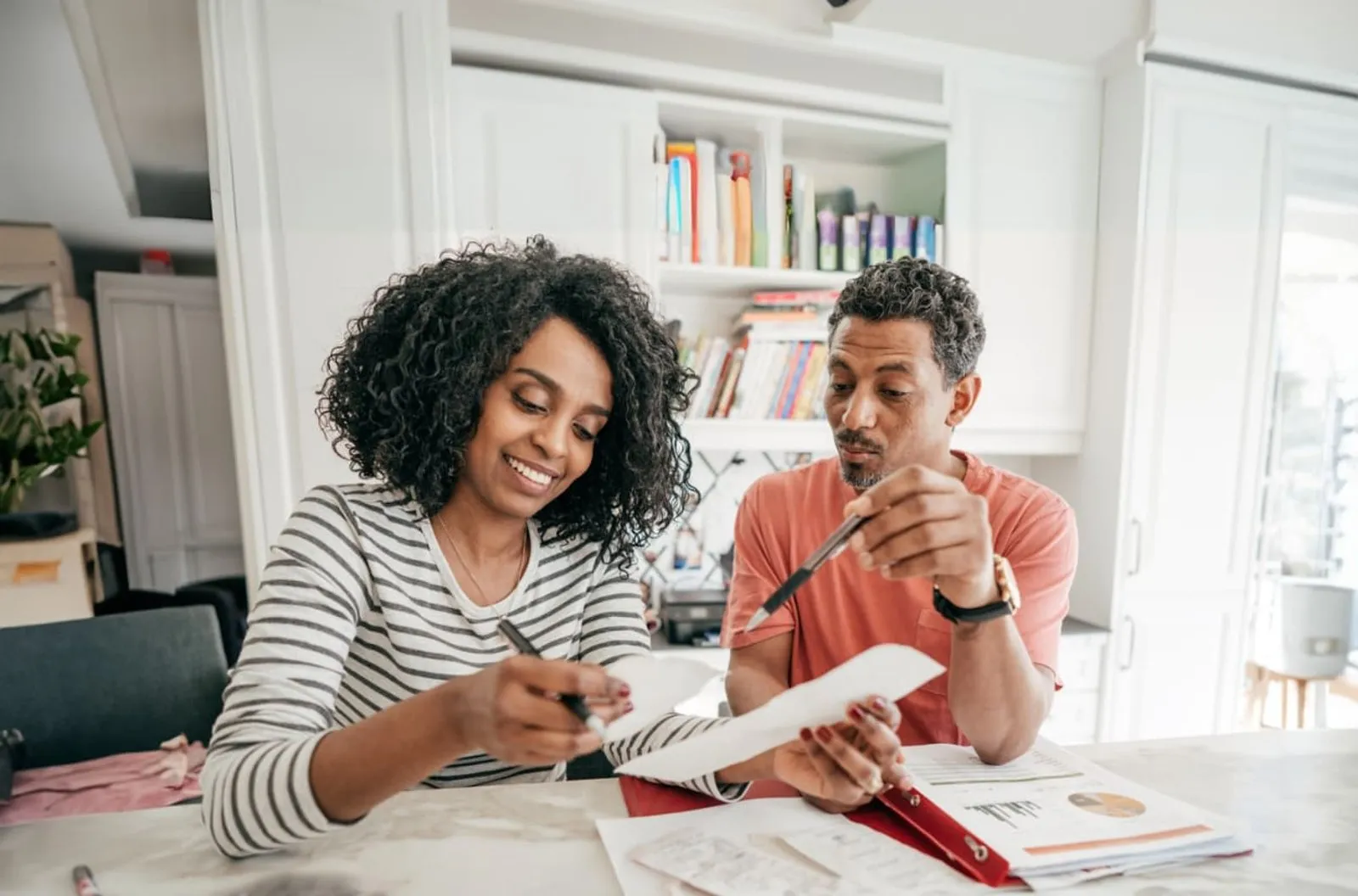 Business partners reviewing paperwork together