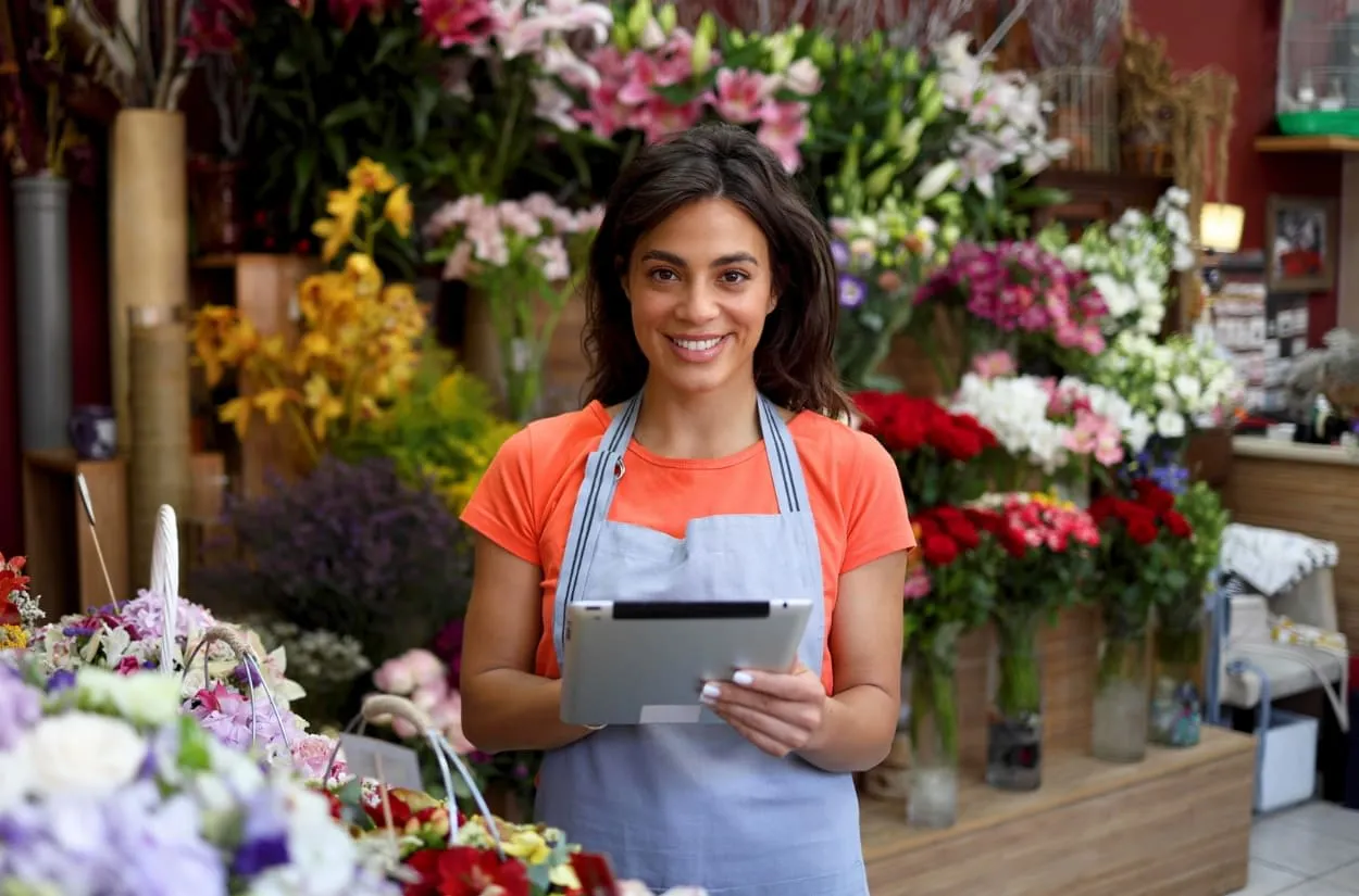 Business owner using QuickBooks in her flower shop