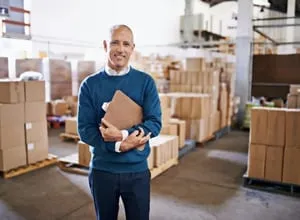 Business owner standing in a warehouse
