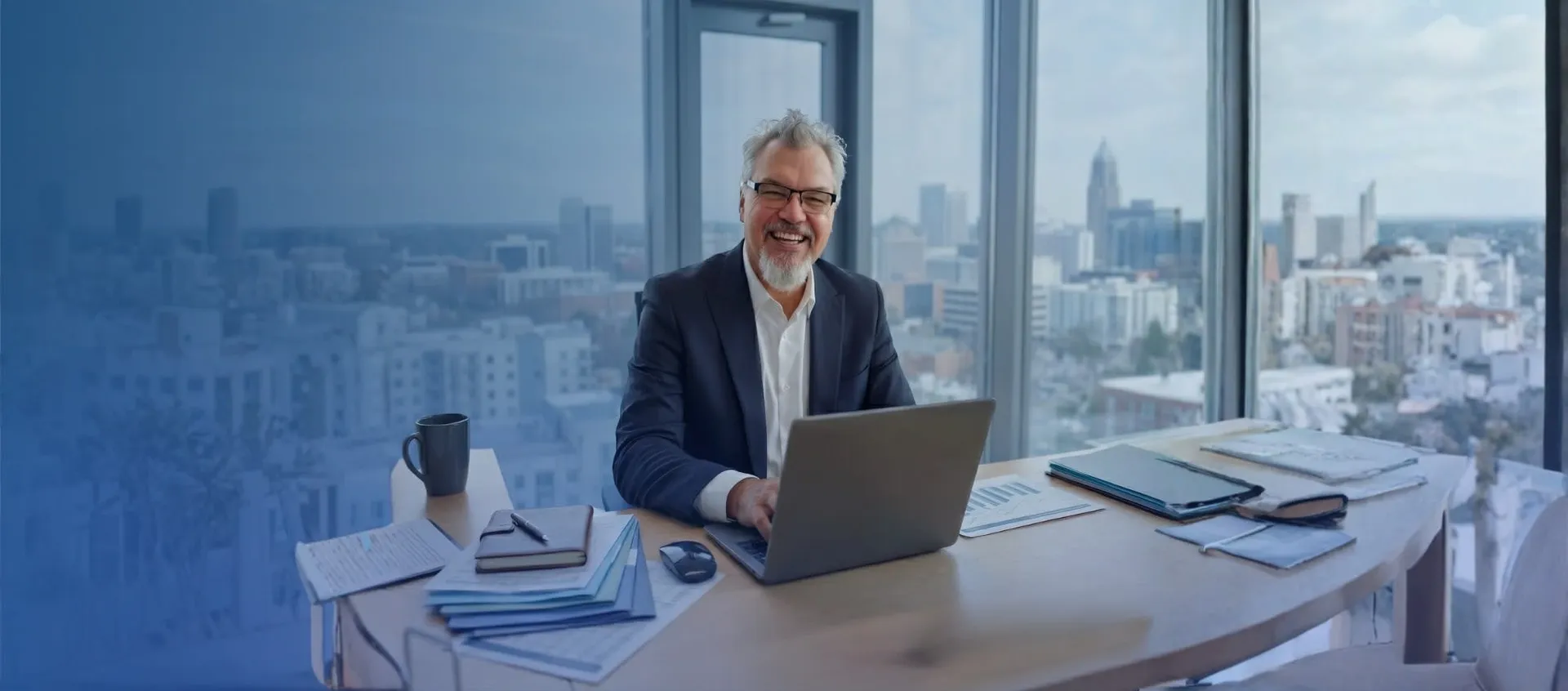Ralph Cummings working at a laptop in a bright office